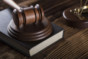 A wooden gavel on a book
