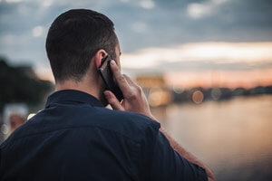 A man on his cell phone concentrating on the call