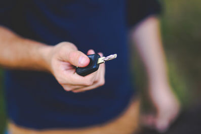 A driver holding his car keys