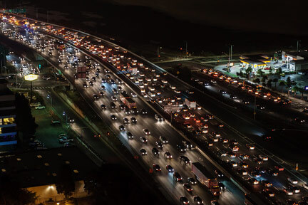 A birds-eye view of heavy traffic at night on an interstate highway 