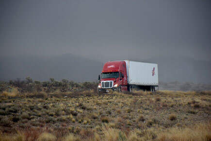 A truck driving on a remote interstate highway