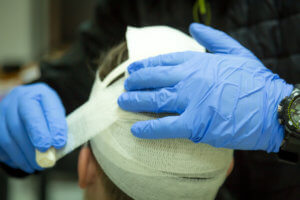EMT treating a severe head injury.